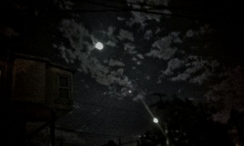 Low angle view of illuminated building against sky