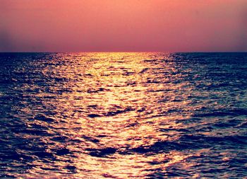 Scenic view of sea at sunset
