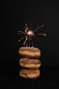 Firework display over black background