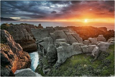 Scenic view of sea against cloudy sky