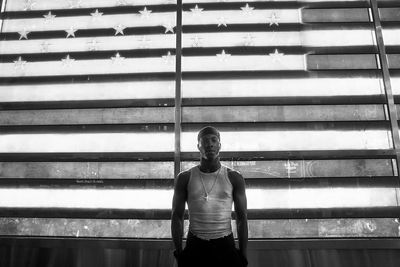 Man standing against wall