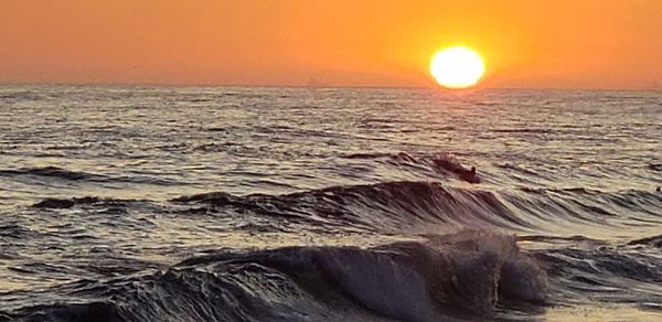 Scenic view of sea against sky during sunset