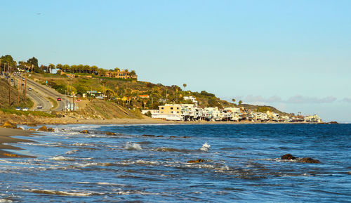 Scenic view of sea against clear blue sky