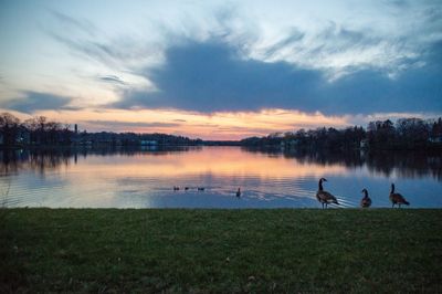 Scenic view of lake against sky during sunset