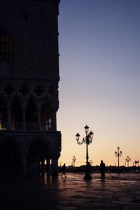 Silhouette of buildings against sky during sunset