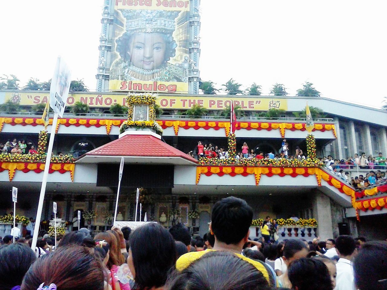 architecture, built structure, building exterior, large group of people, place of worship, religion, spirituality, person, famous place, travel destinations, men, temple - building, tourism, city, sky, facade, lifestyles, tradition, travel