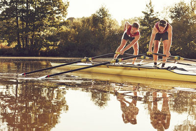 Reflection of people in lake