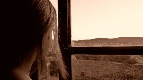 Close-up of train window against clear sky