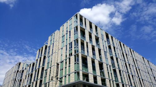 Low angle view of building against cloudy sky