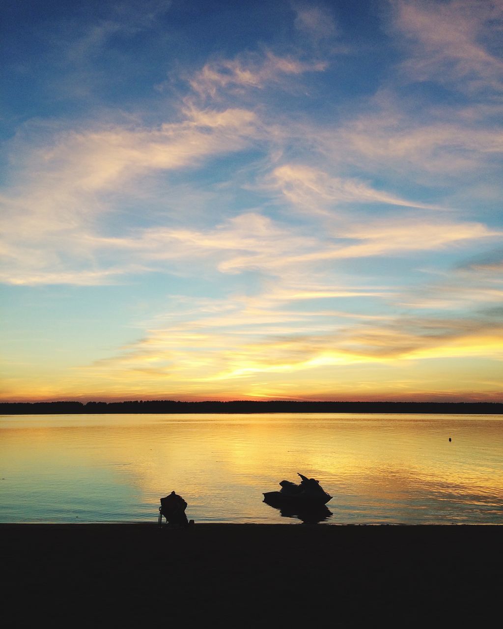 sunset, sky, silhouette, water, cloud - sky, beauty in nature, scenics - nature, sea, tranquility, nature, orange color, tranquil scene, beach, idyllic, real people, land, two people, animal themes, outdoors