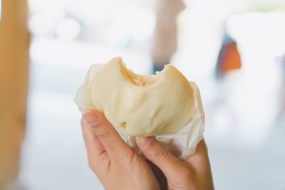 Midsection of person holding ice cream
