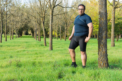 Full length portrait of man standing in park