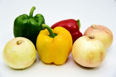 Close-up of bell peppers against white background