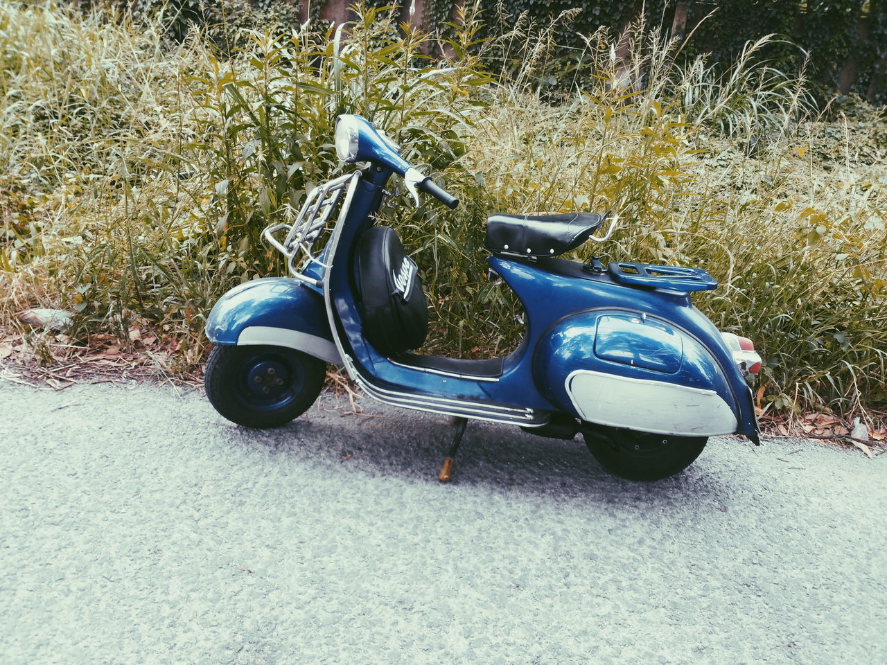 transportation, high angle view, land vehicle, mode of transport, field, street, car, grass, day, outdoors, shoe, road, stationary, no people, nature, sunlight, plant, ground, bicycle, footwear