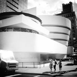 People in front of built structure