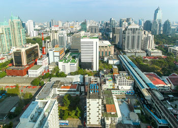 High angle view of modern buildings in city against sky