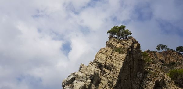 Low angle view of rock formation against sky