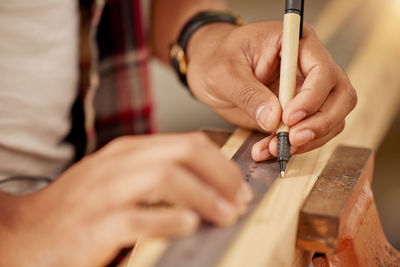 Midsection of man working in workshop