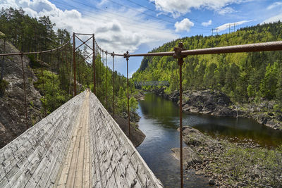 Bridge over river against sky