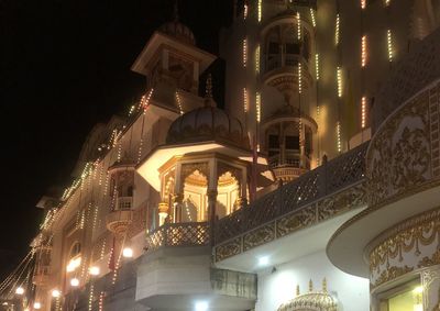 Low angle view of illuminated buildings at night