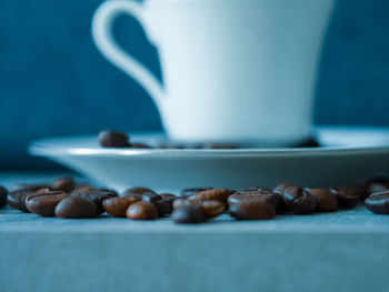 Close-up of coffee beans on table