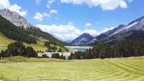 Scenic view of landscape and mountains against sky