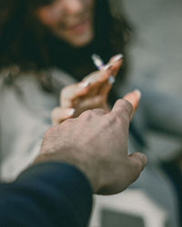 Cropped hand of woman holding hands