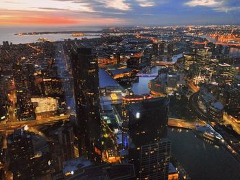 High angle view of illuminated city buildings at night