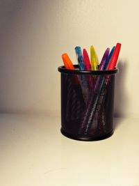 Close-up of multi colored pencils over white background