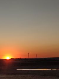 Scenic view of sea against clear sky during sunset