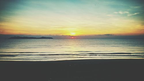 Scenic view of sea at sunset