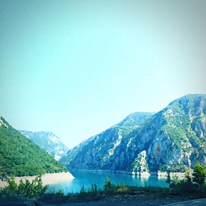 Scenic view of lake with mountains in background