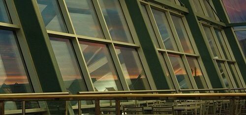 window, indoors, glass - material, full frame, architecture, built structure, backgrounds, pattern, wood - material, transparent, building exterior, curtain, no people, low angle view, building, design, house, repetition, day, reflection