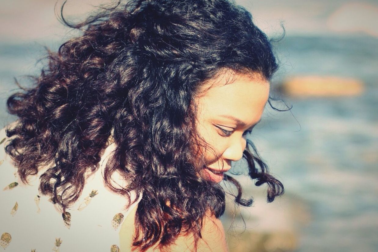 brown hair, close-up, headshot, long hair, curly hair, focus on foreground, black hair, person, young adult, innocence, human hair, nature, human face