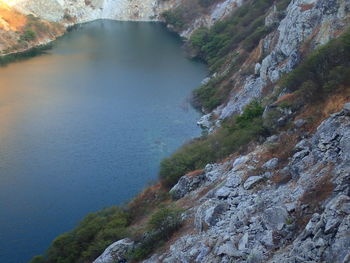 High angle view of lake amidst rocks