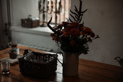 Close-up of flower vase on table at home