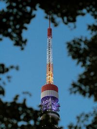 Low angle view of communications tokyo tower against sky