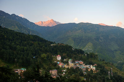 Scenic view of tree mountains against sky