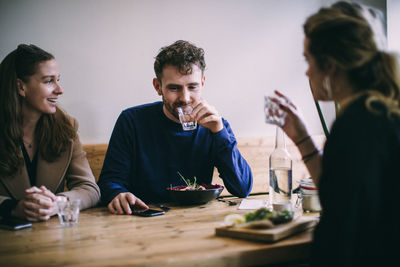 Friends sitting on table