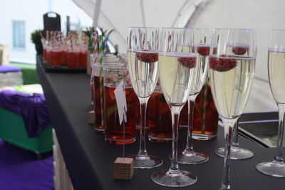 Close-up of wine glasses on table