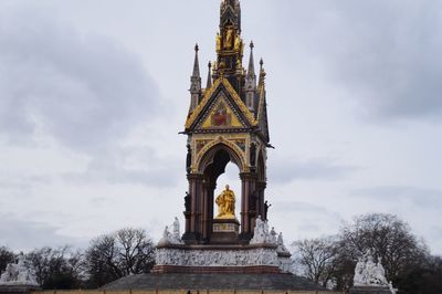 Low angle view of building against cloudy sky