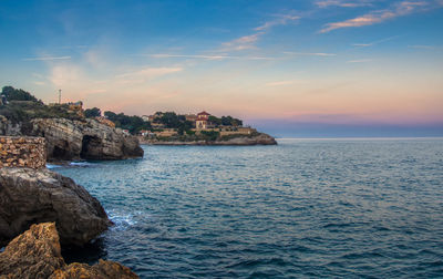 Scenic view of sea against sky during sunset