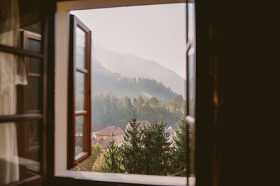 Scenic view of mountains seen through window