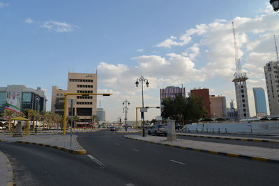 Road in city against sky