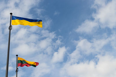 Low angle view of flag against sky
