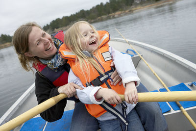 Girl with mother kayaking