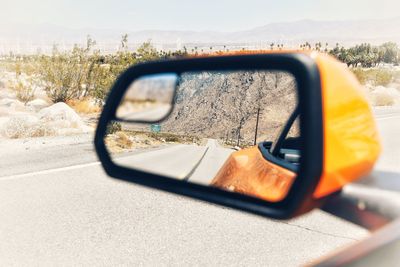 Close-up of car on side-view mirror