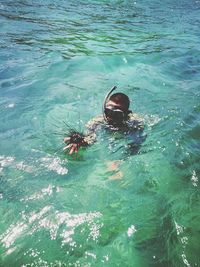 High angle view of person swimming in sea