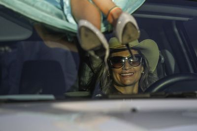 Portrait of woman sitting in car