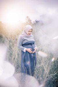 Woman standing on field